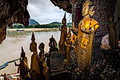 Luang Prabang, Laos - The Pak Ou Caves, the lower cave called Tham Ting. The caves, a Buddhist pilgrimage site, are a repository of old Buddha statues. 